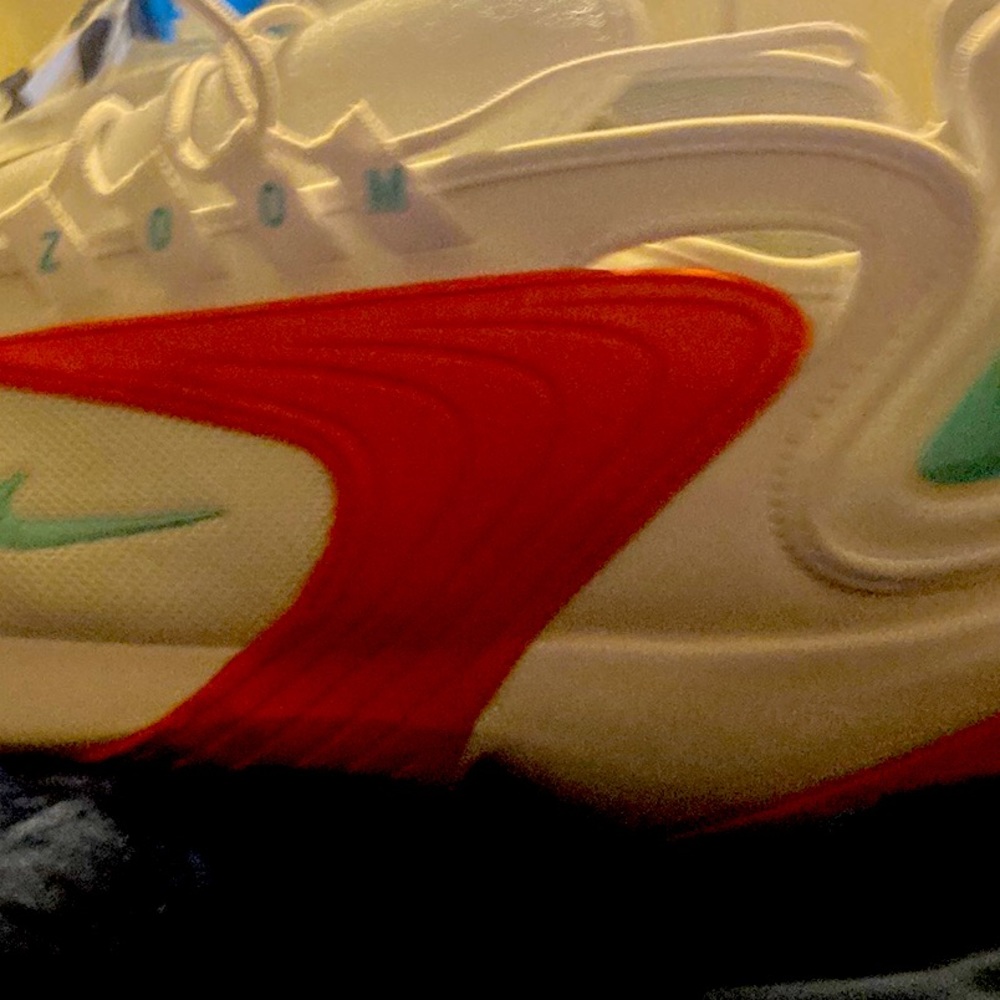 Size 12 Nike Zoom white orange and a little mint green.Men’s slike new
